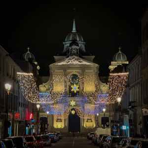 Versailles town streets glowing with Christmas lights at night, capturing the festive spirit and winter magic of France at Christmas.